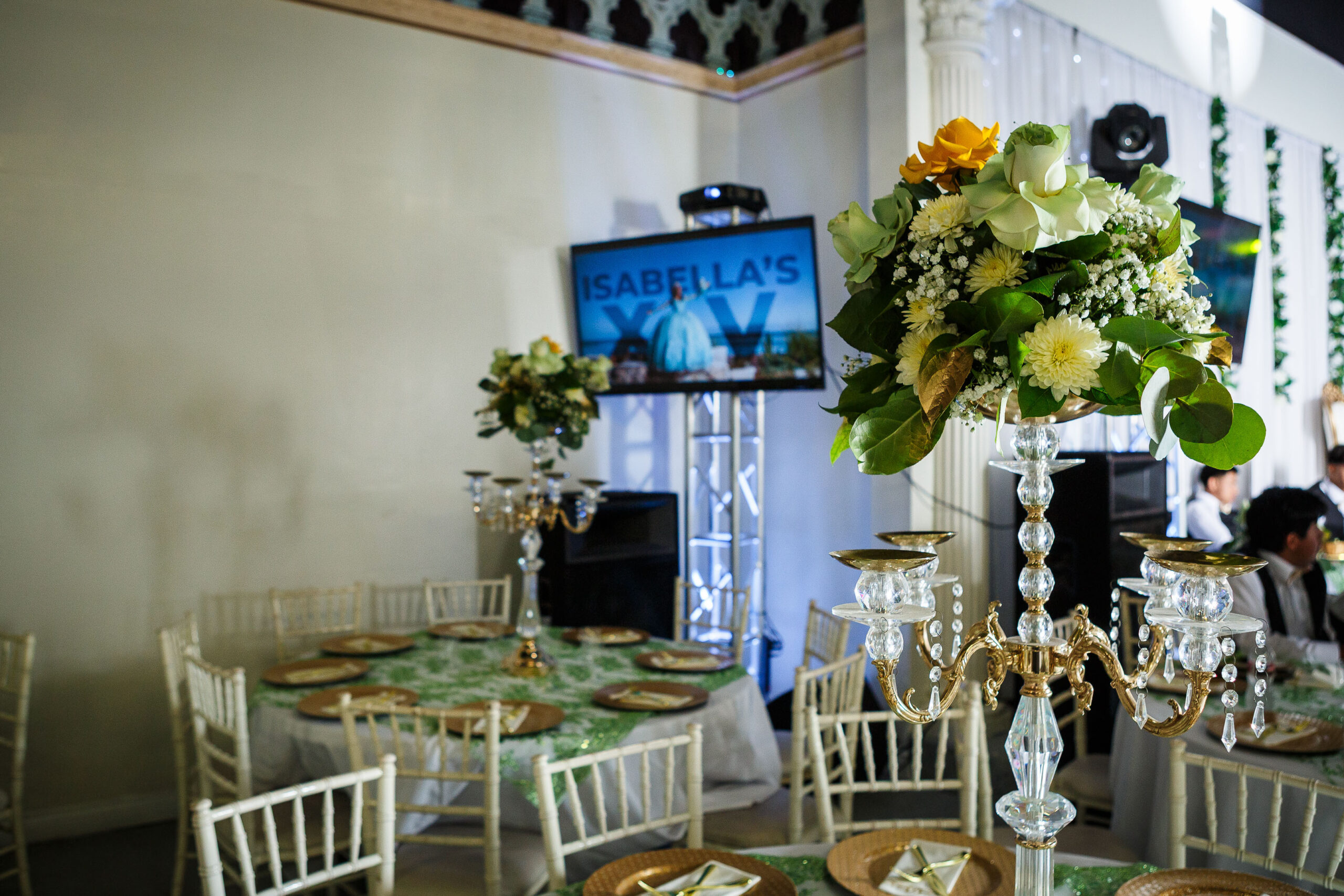 Quinceañera celebration setup with portrait display